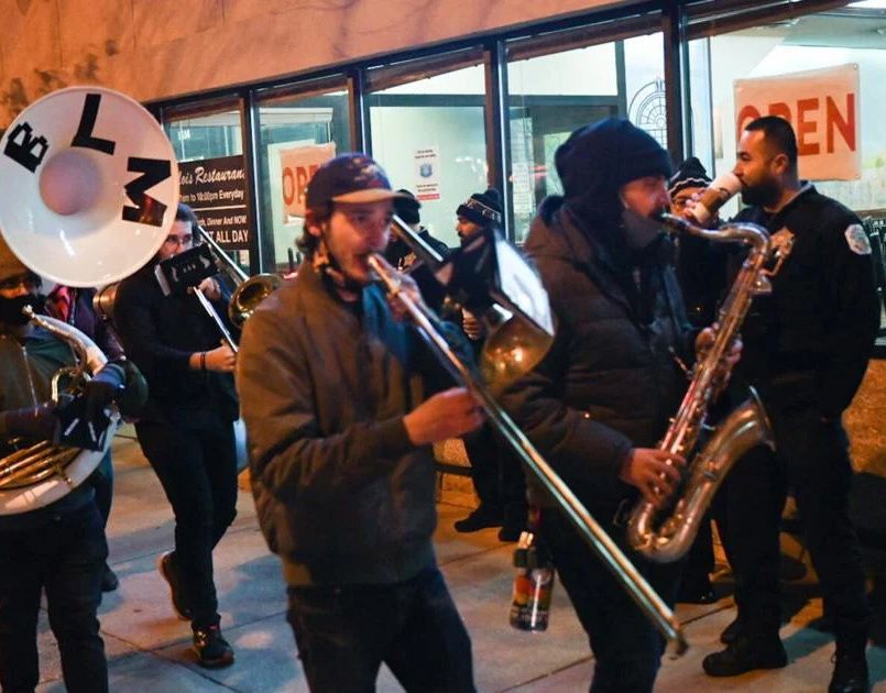 A brass band playing at CollaBOOration on 53rd Street